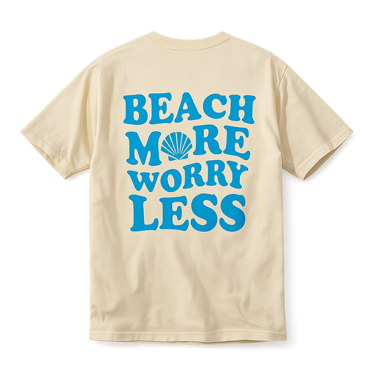 Yellow short sleeve t-shirt with blue text reading ‘Beach More Worry Less’ and a seashell graphic on the back.