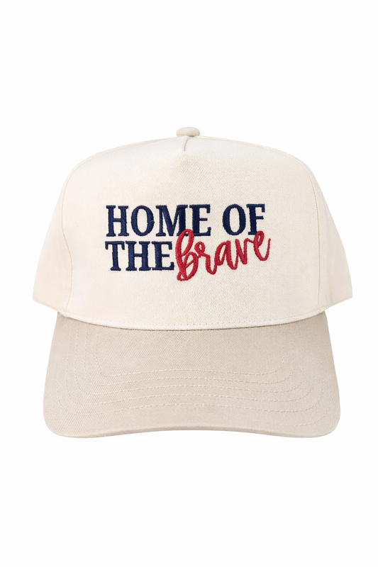 Beige cap with 'Home of the Brave' text on a white background